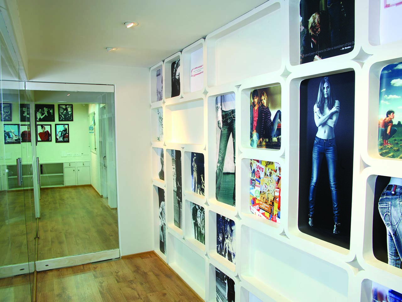 Photos displayed on the wall at Vastram office